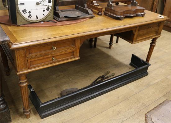 A late 19th century French oak writing desk W.180cm